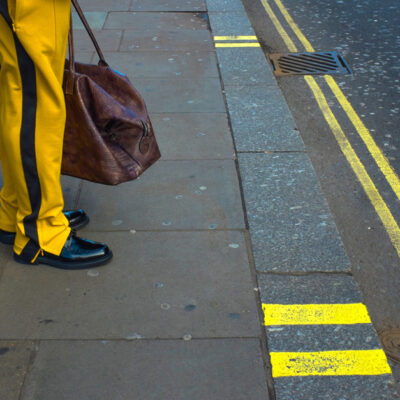 3-If walls could speak-streetphotography-london-everydaylife-documentary-city-bus stop-man-color-shopping-shopper-zebra cross-stripes-yellow