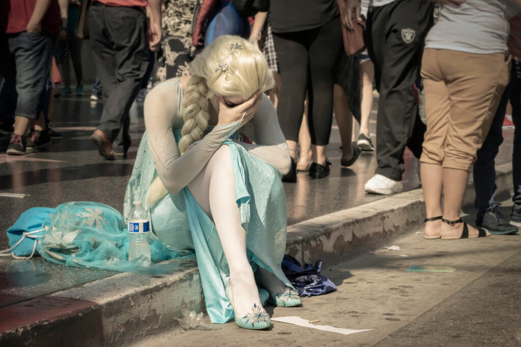 sad white girl with long blue dress