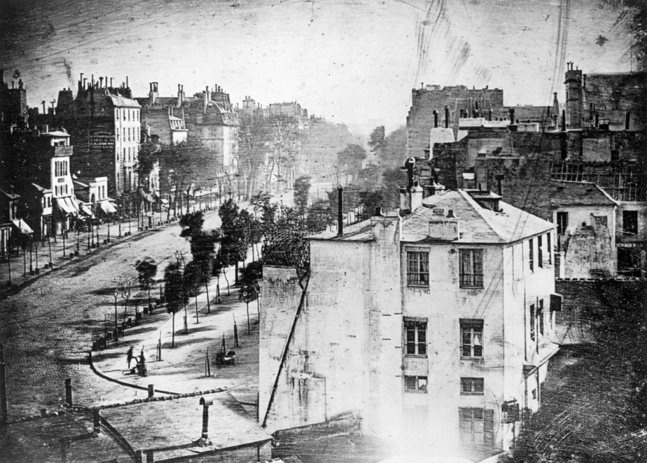 The earliest known street photograph, Boulevard du Temple in Paris, taken by Louis Daguerre in 1838 showing a man getting his boots polished