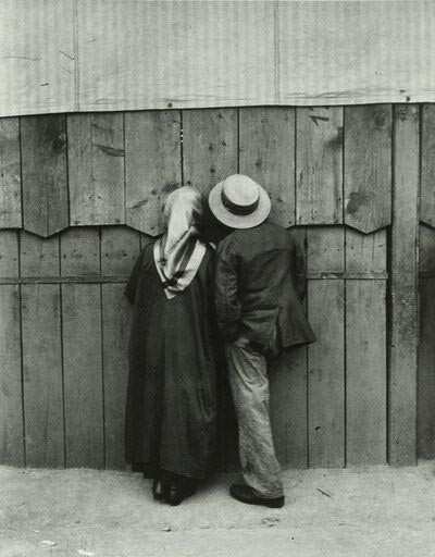 Street photographer Andre kertesz captured a man and woman watching.