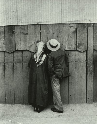 Street photographer Andre kertesz captured a man and woman watching.